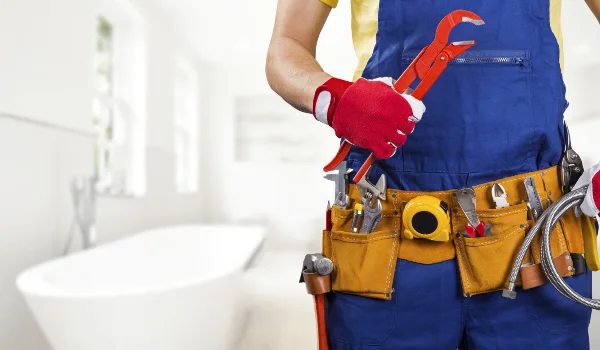 the torso of a plumbing technician showing a tool belt in Leander, TX - Kitchen Plumbing Redesign